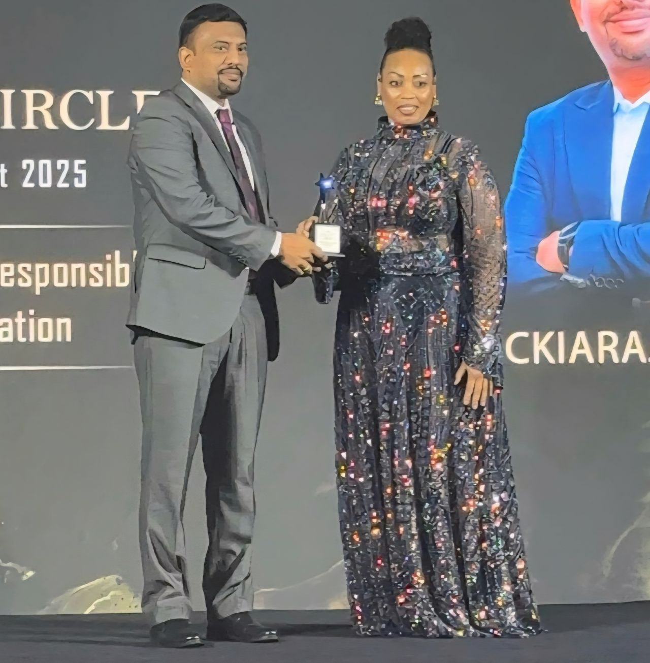 Arockiaraj Arockiam receiving his Legacy Circle recognition on stage